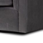 Close-up of layered vertical channel tufting on back and armrest with natural sheen
