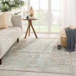 Living room setting with Stag Oriental rug under side table and sofa, showing scale and light filtering through windows