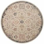 Round version of the Giada rug showing full patterned surface with navy border