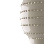 Close-up side view showing glossy finish and detailed bead texture along horizontal rows.