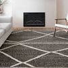Similar living room setting with charcoal and beige rug viewed from a slightly different angle and lighting