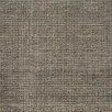 Charcoal wool rug with a textured grid pattern of soft, watercolor-inspired color variations