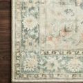 Detailed corner view of Rosette rug on dark wood floor showcasing edge finishing and pattern