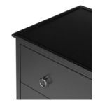 Close-up of nightstand corner showing top tray edge detail and metal ring handle side profile