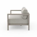 Side profile of Sonoma 60-inch outdoor sofa highlighting teak armrests and cushion depth