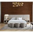 Reyes Ottomans shown in bedroom wider view, highlighting scale and relation to bed, nightstands, and seating