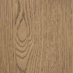 Close-up of drifted oak wood grain texture on cabinet surface