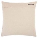 Back side of pillow with visible fabric flap closure and small brand label