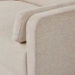 Close-up view of arm bolster pillow and loose back cushion on sectional corner