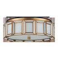 Flush mount ceiling light shown from side angle highlighting white panels and brushed brass metal rim