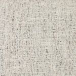 Macro texture view of the light gray woven performance fabric upholstery