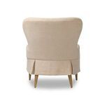 Rear shot of Omar Chair showing pleated skirt and smooth linen backrest
