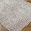 Close-up angled view of Margot rug showing woven texture and detailed pattern on hardwood floor