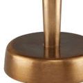 Macro detail of brushed antique brass finish on lamp base