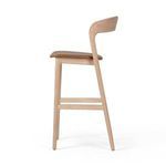 Side view of Amare Stool displaying curved backrest and tapered legs
