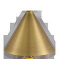 Close-up of the brushed brass metal cone shade of Traipse Cordless Table Lamp