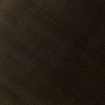 Close-up of acid-etched geometric pattern on the table's round top surface