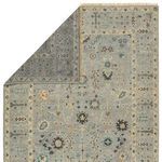 Rug corner folded over revealing its ivory and tan wool underside