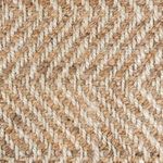 Close-up of chevron weave texture showing interlaced light and natural jute fibers in a detailed pattern