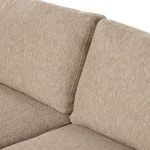 Close-up of side chaise armrest and cushion showing fabric's woven texture