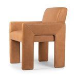 Close-up of tan leather upholstery with tight grain and subtle patina texture