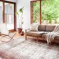 Layla Ivory Brick Rug styled in bright living room next to sofa and chair, showing full rug in natural setting