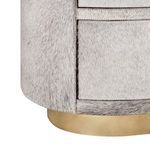 Close-up of side edge highlighting light faux fur texture and gold base