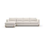 Front view of left chaise sectional highlighting four back cushions and three seat cushions in cream upholstery