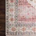 Close-up of corner edge of Skye rug on dark wood floor highlighting pattern and delicate border