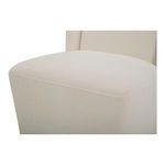 Close-up of plush seat cushion edge illustrating soft cream fabric weave