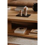 Casey coffee table as part of a styled living space with light area rug and upholstered sofa