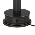 Black power cord plugged into round charging base for Traverse cordless table lamp