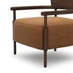 Front-side close-up highlighting thick ochre cushion and oak arm rail joint
