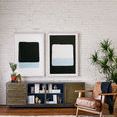 Gallery wall close up of paired abstract paintings with inverted color blocks and mid-century modern furniture