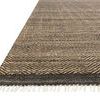 Close-up angled view highlighting texture, fringe detail, and darker border of Omen Mocha Rug