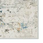 Zoomed view of Jehan rug corner highlighting stitched edge and intricate dot pattern in neutral shades