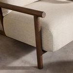 Cardiff Outdoor Chair styled in a wood-paneled outdoor patio with side table and plants