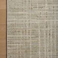 Wade Mist Gold Rug corner on wood floor showing clean edge and subtle color variations