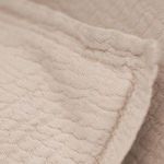 Extreme close-up of Waverly Big Pillow show wavy, pebbled 100% cotton texture and stitching detail