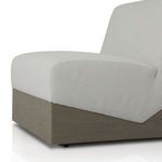 Close-up angled view highlighting chair’s cushioned seat and rectangular wood base