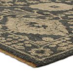 Close angled shot revealing yarn texture and subtle color variations in Maeli rug fibers