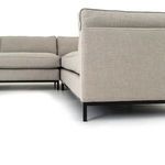 Angled close-up focusing on fabric texture and neat armrest seams