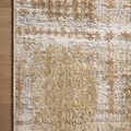 Top corner view of Wyatt Adobe Dove rug highlighting color variation and stitching detail on hardwood floor