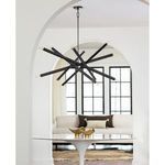 Viper Chandelier hanging in a bright modern room over a white tulip table