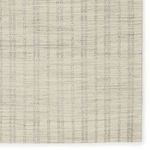 Top-down detail of striped ticking pattern and natural wool fibers highlighting handwoven texture