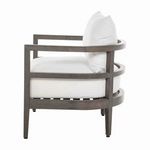 Side profile showing layered armrest design and thick white cushions on gray wood frame