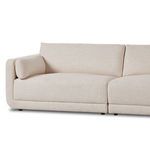 Angled front view of Toland sectional highlighting loose arm cushion on left side