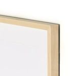 Close-up of natural maple wood frame corner with visible wood grain and joinery