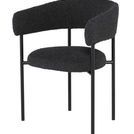 Cassia Dining Chair angled view showing curved armrests and seat cushion depth