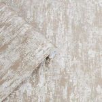 Rolled Whinfell Champagne wallpaper showing texture and metallic highlights on the neutral patterned surface